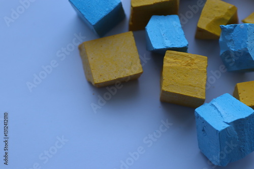 Paint for soy wax in the form of cubes, yellow 
paint, blue paint photo