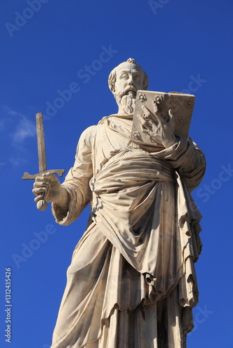 Statue of Saint Paul Holding a Book and a Broken Sword at the Ponte Sant'Angelo Bridge in Rome, Italy, March 2025