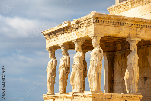 Ancient Erechtheion Greek temple with Porch of the Caryatids on the north side of the Acropolis in Athens, Greece. It was dedicated to both Athena and Poseidon. Caryatids at Porch of the Erechtheion,.