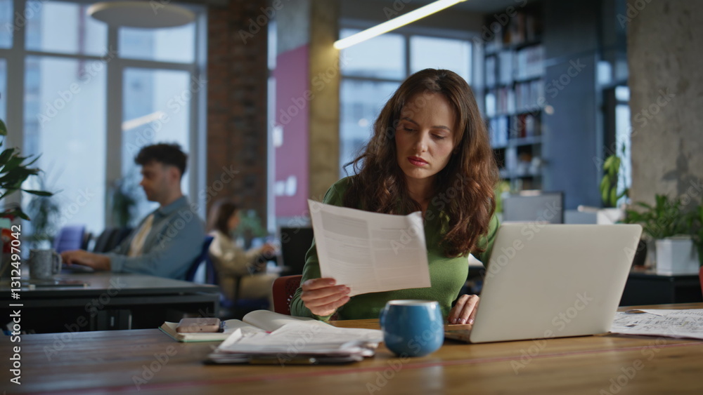 Lady manager examining documents in office closeup. Smiling successful woman Lady manager examining documents in office closeup. Smiling successful woman