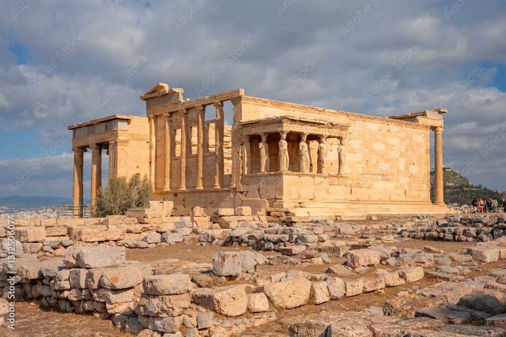 Fototapeta premium Ancient Erechtheion Greek temple with Porch of the Caryatids on the north side of the Acropolis in Athens, Greece. It was dedicated to both Athena and Poseidon. Caryatids at Porch of the Erechtheion.