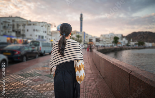 Strolling Along the Waterfront of Muttrah Corniche in Muscat capital city of Oman during Golden Hour