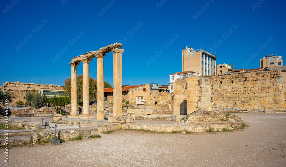 Naklejka premium The most famous architectural landmarks of ancient greek heritage located in the Plaka district in Athens, Greece: the library of Hadrian, Wind tower, medieval mosque