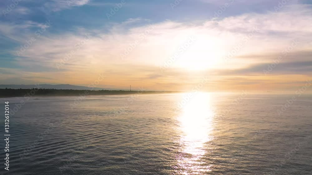 A drone flies over the water towards the shore, watching the sun reflect on the ocean surface. Sunset. Aerial drone shot, 4K A drone flies over the water towards the shore, watching the sun reflect on the ocean surface. Sunset. Aerial drone shot, 4K