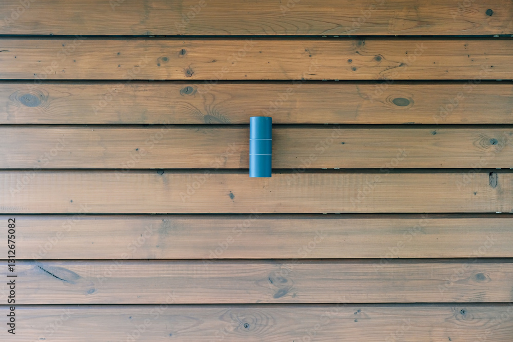 Wooden wall of a building with a street lamp Wooden wall of a building with a street lamp