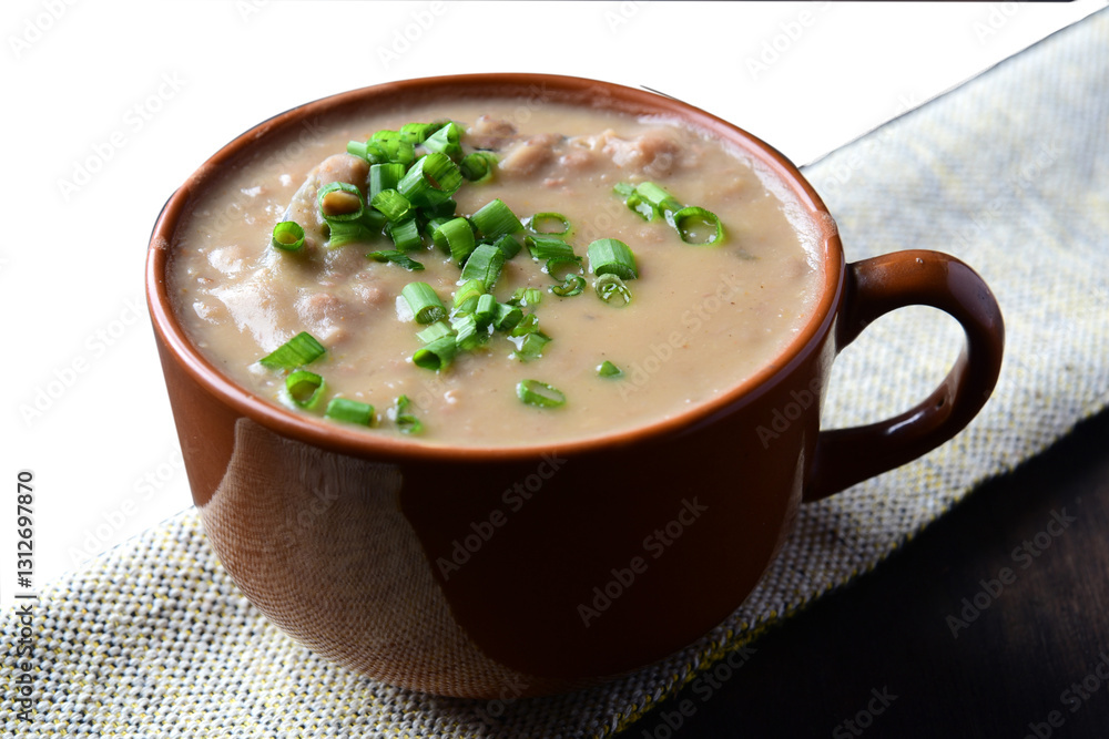 Delicious dish of Brazilian cuisine called Caldo de Feijão. Made with black beans, bacon and sausage. Bean broth. feijoada Delicious dish of Brazilian cuisine called Caldo de Feijão. Made with black beans, bacon and sausage. Bean broth. feijoada