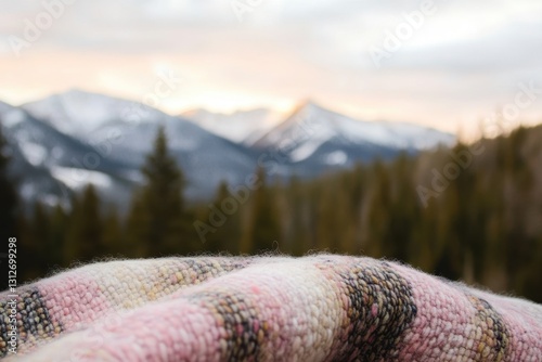 Cozy Blanket Overlooking Tranquil Mountain Forest at Sunset photo