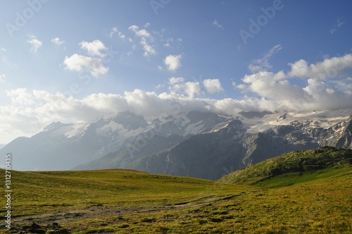 mountain landscape with blue sky and clouds, tour of the Ecrins and Oisans Massif, hiking, trek, GR54, Alps, France