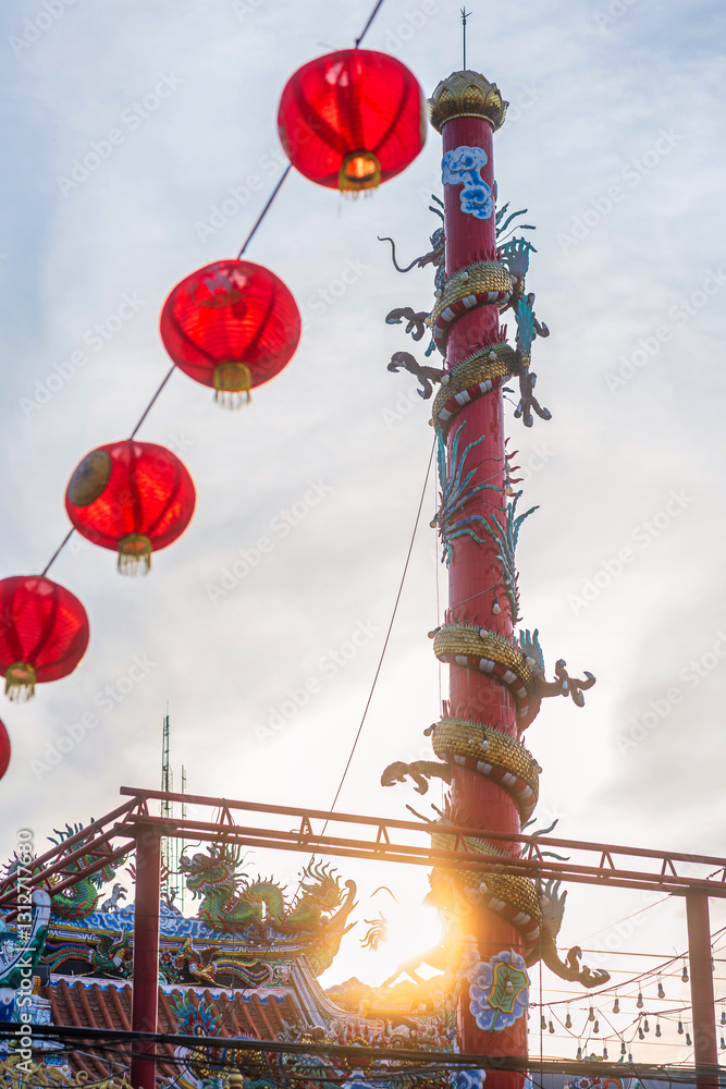 Beautiful Elegant double golden dragon statue on the roof of on a temple for Chinese New Year Festival at Chinese shrine with blue sky.