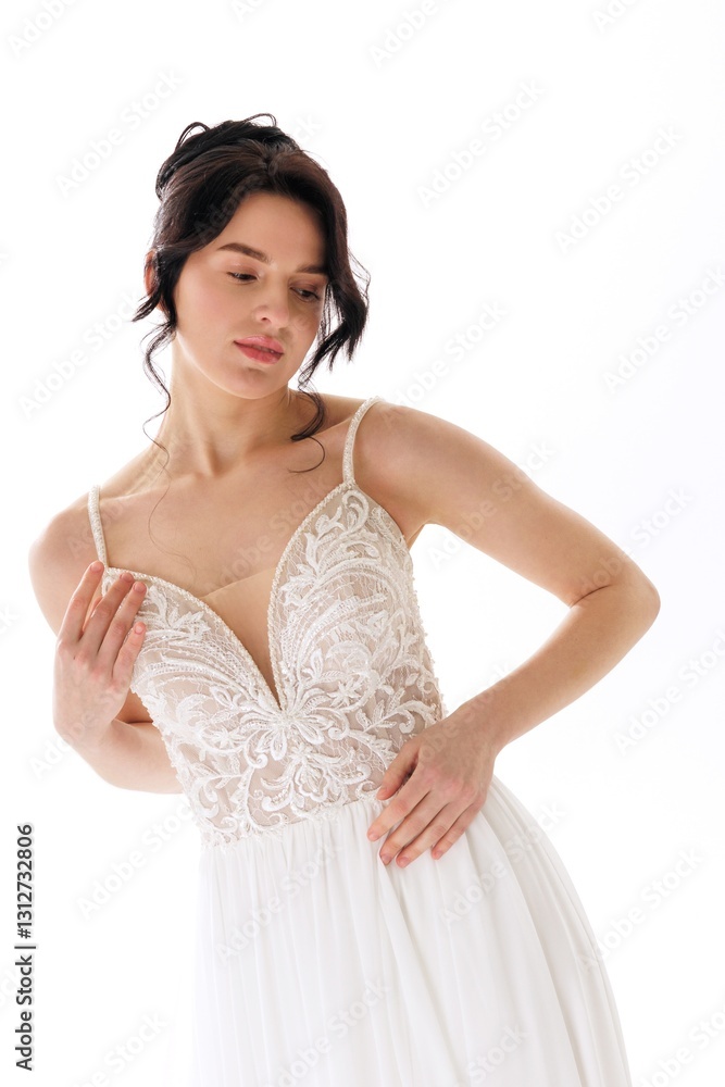 Elegant woman wearing a white dress with intricate lace details posing gracefully in a soft light setting Elegant woman wearing a white dress with intricate lace details posing gracefully in a soft light setting