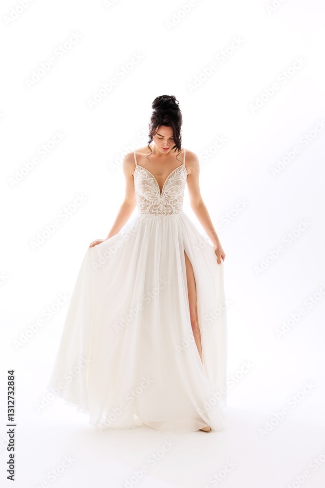 Elegant model poses in a flowing white dress with intricate details and a high slit in a bright studio setting during a fashion shoot Elegant model poses in a flowing white dress with intricate details and a high slit in a bright studio setting during a fashion shoot