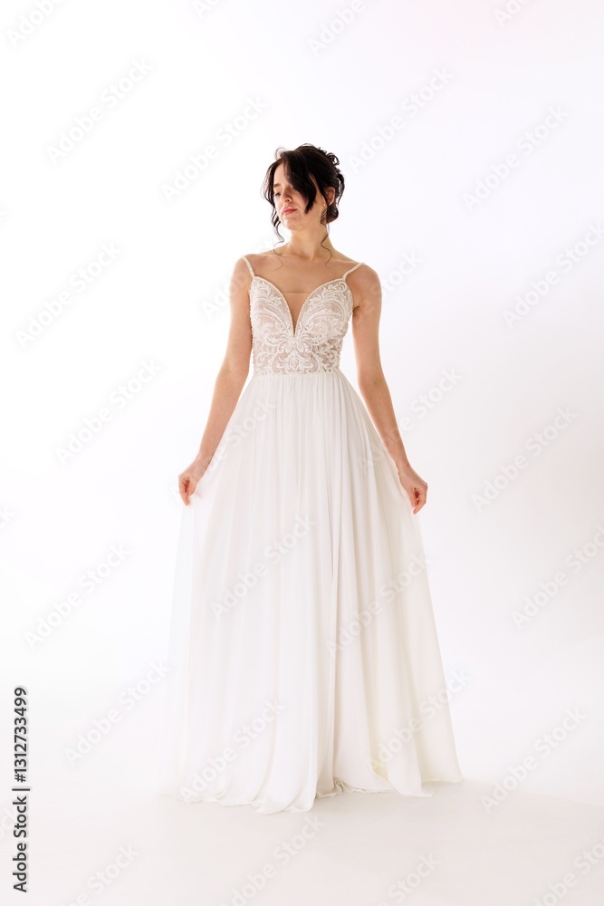 Elegant model showcasing a stunning white wedding dress against a clean background Elegant model showcasing a stunning white wedding dress against a clean background