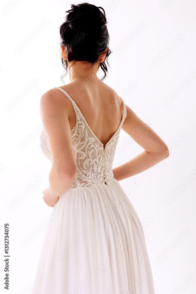Elegant bridal gown design featuring intricate lace details and a flowing silhouette in a bright studio setting Elegant bridal gown design featuring intricate lace details and a flowing silhouette in a bright studio setting