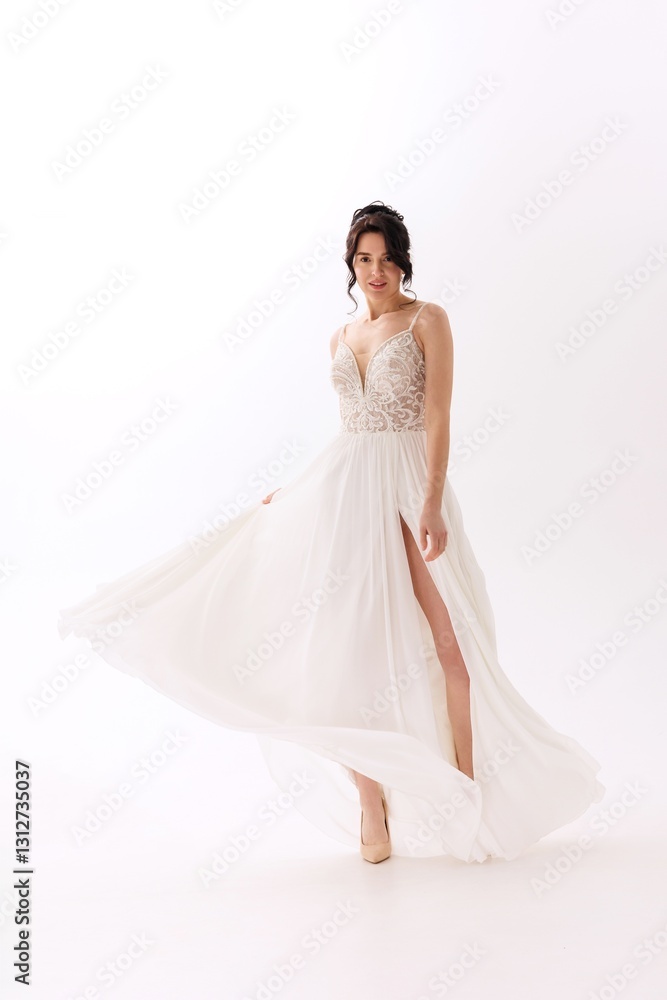 Stunning bride in elegant gown showcases beauty and grace during a wedding photoshoot in a minimalist studio Stunning bride in elegant gown showcases beauty and grace during a wedding photoshoot in a minimalist studio