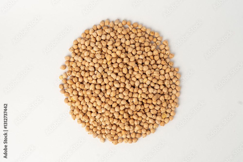 Many chickpeas scattered on a white background, isolated, top view, raw uncooked legumes, healthy organic food, high-protein vegetarian ingredient, nutritious dried peas, agriculture harvest Many chickpeas scattered on a white background, isolated, top view, raw uncooked legumes, healthy organic food, high-protein vegetarian ingredient, nutritious dried peas, agriculture harvest
