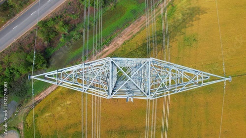 High-voltage power lines pass through agricultural areas in rural areas. Large power transmission lines are located on electric poles. electricity pylons  Power line