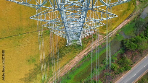 High-voltage power lines pass through agricultural areas in rural areas. Large power transmission lines are located on electric poles. electricity pylons  Power line