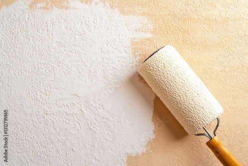 Painting wall with roller, light beige background photo