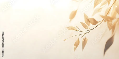 Delicate branch with beige leaves, soft light, and subtle shadows. Peaceful nature scene