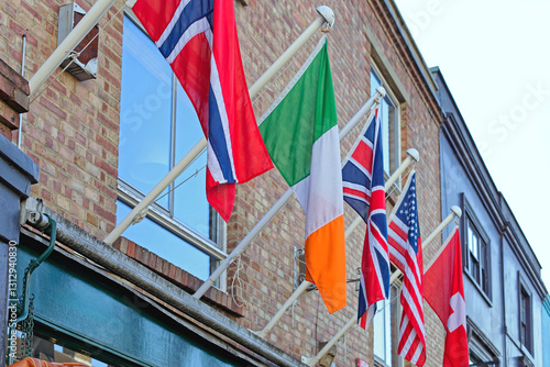 Obraz na płótnie World Flags in Row at Old Building International Travel in London United Kingdom w salonie