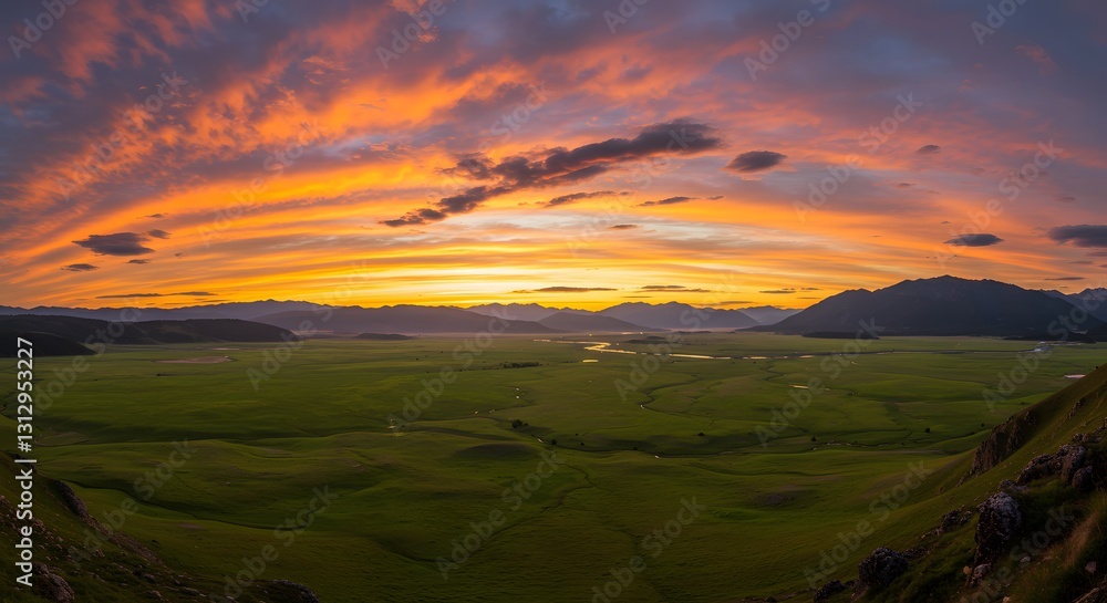 Dramatic Sunset over Lush Green Valley and Mountain Range Dramatic Sunset over Lush Green Valley and Mountain Range