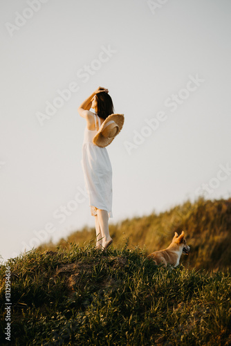Obraz na płótnie An Ethereal Dreamer with their beloved Dog at Dusk on a Serene Hillside, embracing the beauty w salonie