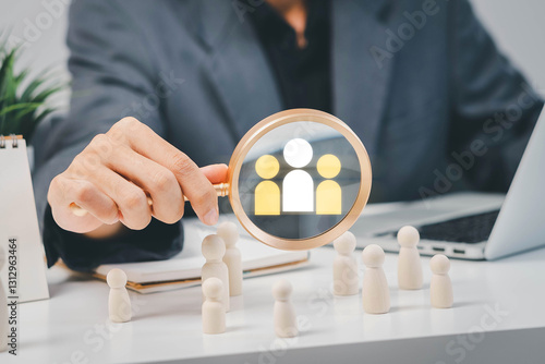 Fototapeta Naklejka Na Ścianę i Meble -  Businessman use magnifying glass to find human icon for business CRM or Customer Relation Management and customer focus target group concept, social media. Digital marketing online. HRM, human manage.