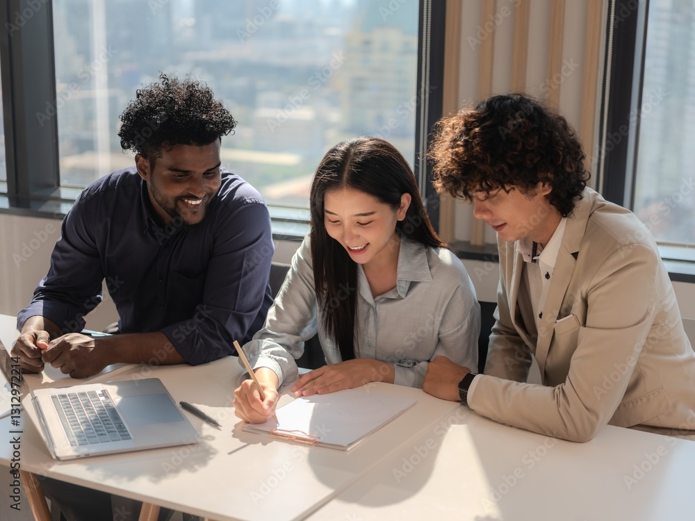 Diverse Team Collaborating on Business Planning and Strategy in Office