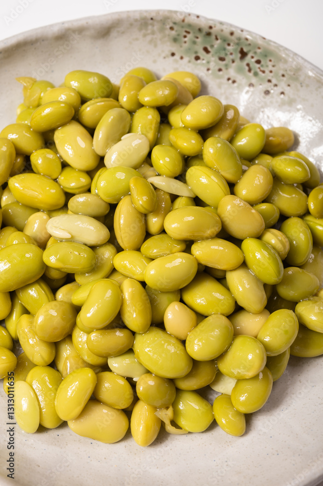Asian vegetarian food cooked green soybeans on board Asian vegetarian food cooked green soybeans on board