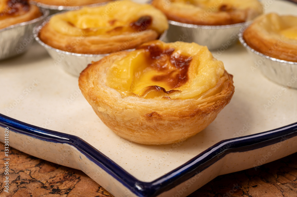 Φωτογραφία Portugal's traditional sweet dessert Pastel de nata egg custard tart pastry in c