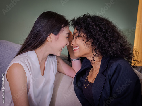 Intimate affectionate moment between two loving women in a warm embrace