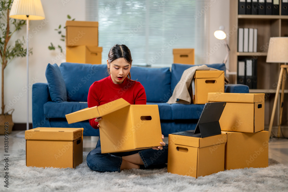 A woman sits on the floor in front of a pile of cardboard boxes A woman sits on the floor in front of a pile of cardboard boxes
