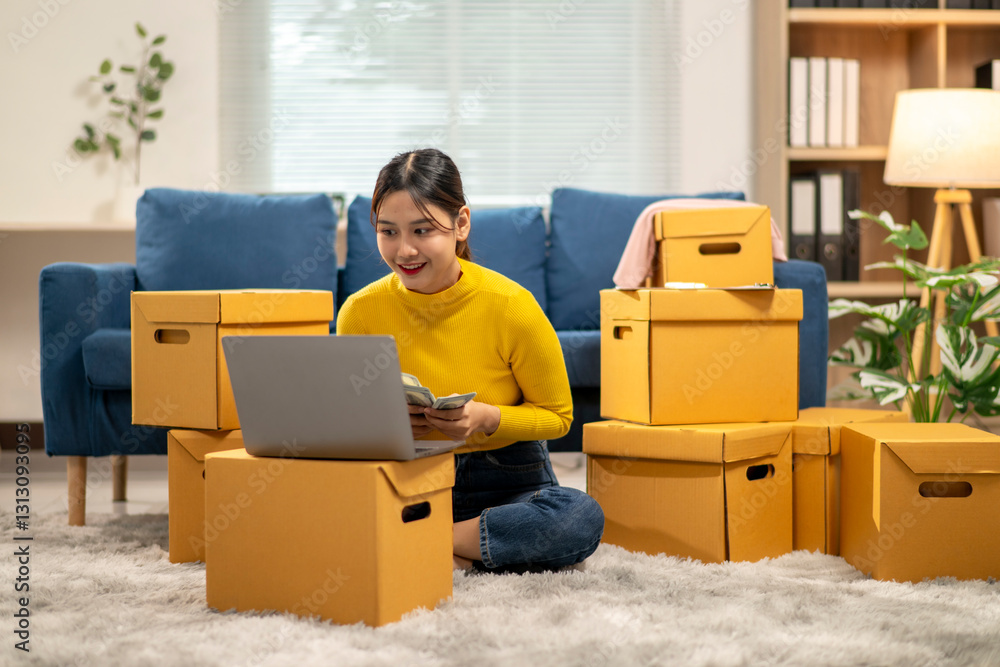 A woman sitting on the floor in front of a pile of cardboard boxes A woman sitting on the floor in front of a pile of cardboard boxes