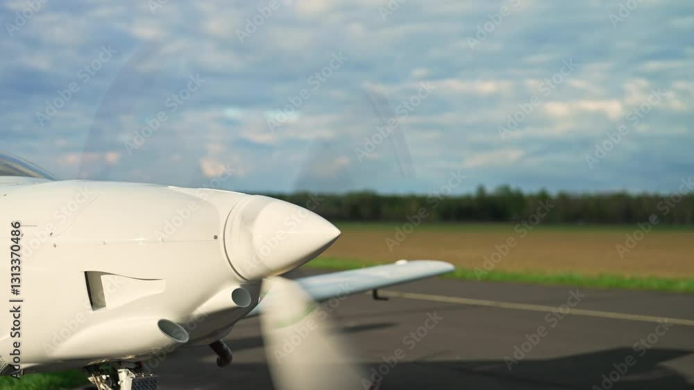 Aircraft engine turbine spinning rapidly on a runway, preparing for takeoff, starting and speeding up at stand still, medium static backdrop Aircraft engine turbine spinning rapidly on a runway, preparing for takeoff, starting and speeding up at stand still, medium static backdrop