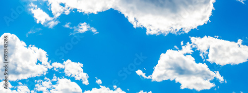 cumulus clouds in a refreshing blue summer sky.