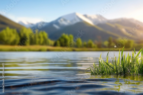 Scenic view of a peaceful lake surrounded by majestic peaks and vibrant trees.  