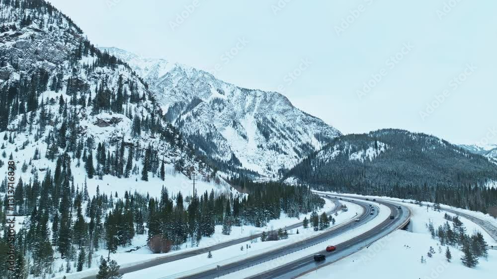 Aerial establishing of snow covered highway winding through evergreen forests between Frisco and Silverthorne, Colorado Aerial establishing of snow covered highway winding through evergreen forests between Frisco and Silverthorne, Colorado