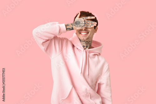 Happy handsome young tattoo...