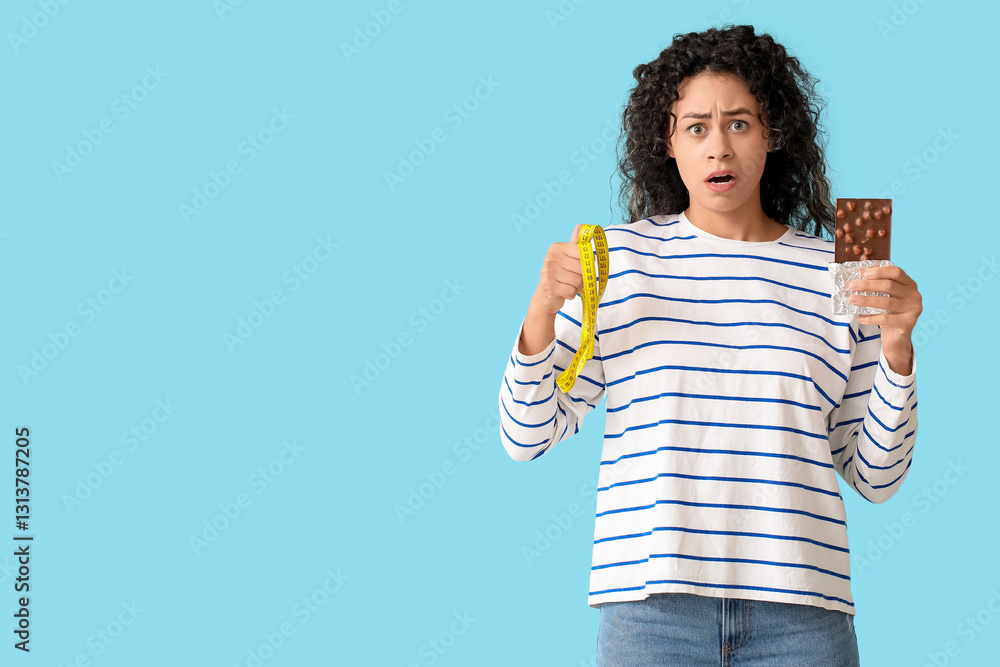 Φωτογραφία Confused young woman holding measuring tape and chocolate bar, diet and weight l