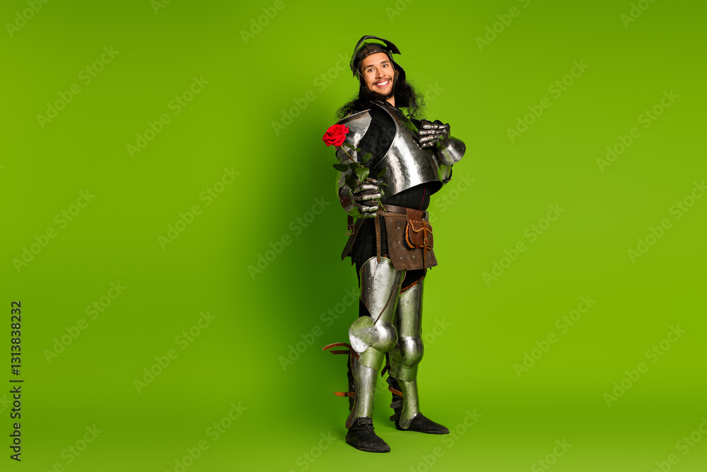 Young medieval knight holding a rose, standing amidst a vibrant green background wearing full steel armor, symbolizing chivalry and romance Young medieval knight holding a rose, standing amidst a vibrant green background wearing full steel armor, symbolizing chivalry and romance