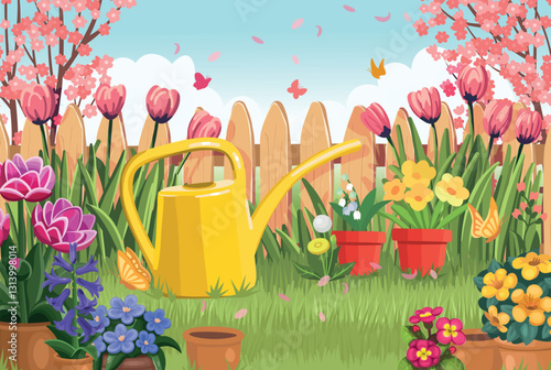 Backyard with a fence, flowers in pots and a watering can. Beautiful spring landscape. Blooming garden. Flower care.