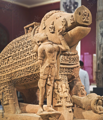 Obraz na płótnie Close-up View On Varaha - Colossal Boar Is Third Incarnation Of Lord Vishnu. Varaha Is Depicted As Boar Or In Anthropomorphic Form, With Boar's Head And Human Body. Varaha and His Consort Bhumi w salonie