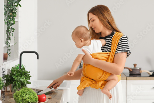 Young mother with little ba...