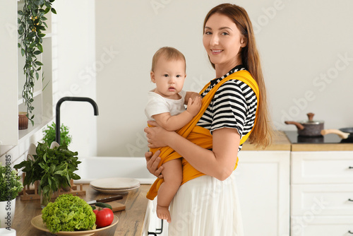 Happy young mother with lit...