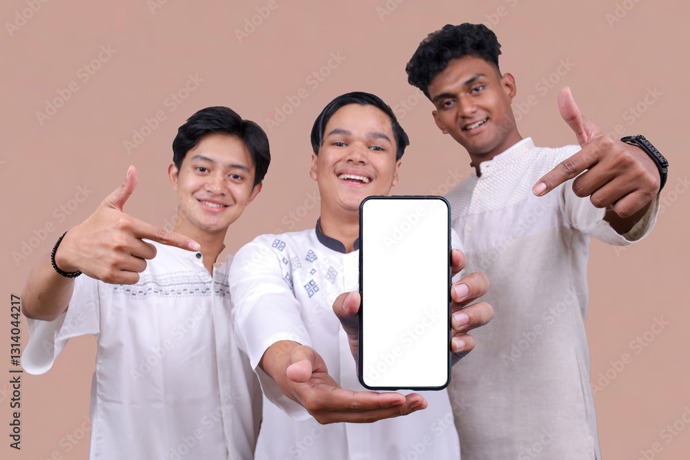 Group Of Young Muslim Men Showing And Pointing At Blank Smartphone Screen Isolated On Beige Background Group Of Young Muslim Men Showing And Pointing At Blank Smartphone Screen Isolated On Beige Background
