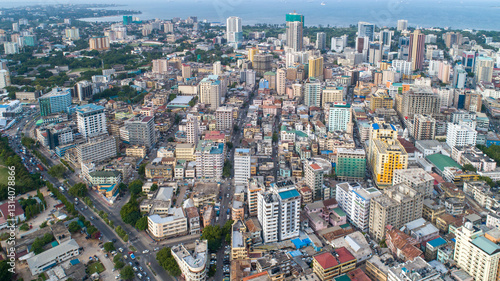 A breathtaking aerial drone shot of Dar Es Salaam, capturing the city's vibrant skyline, bustling streets, and coastal beauty. Perfect for travel, urban, and technology themes