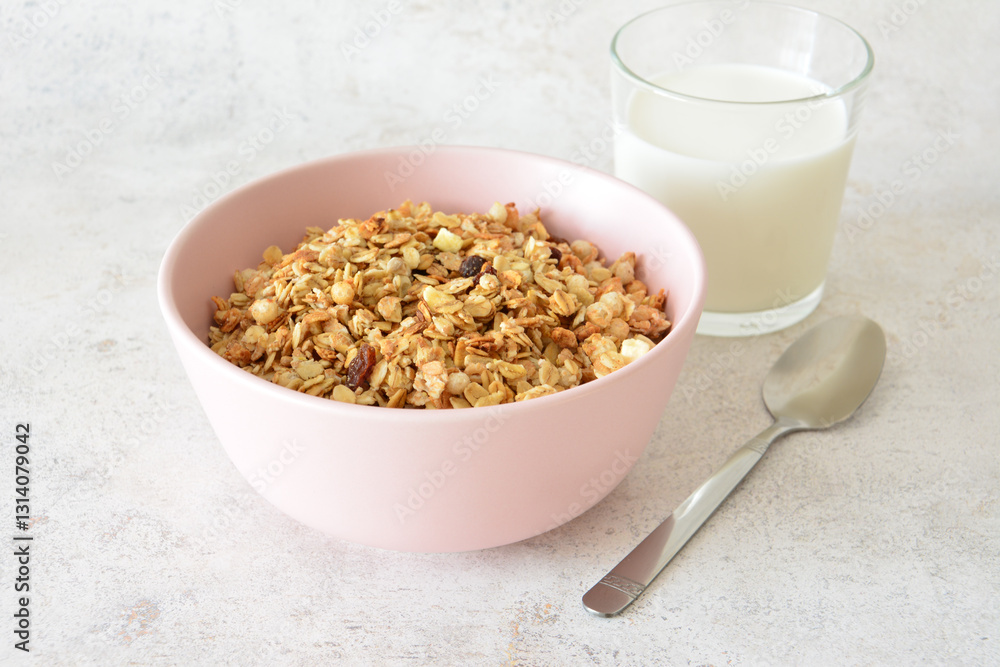 muesli in pink bowl with Milk and spoon quick breakfast muesli in pink bowl with Milk and spoon quick breakfast