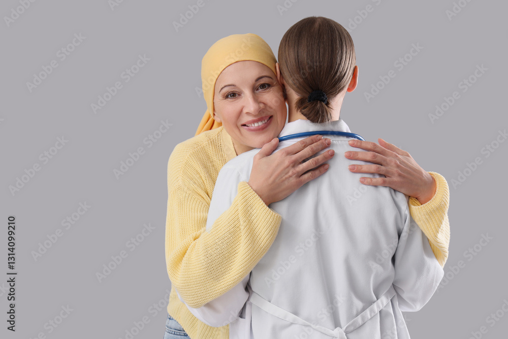 Mature woman after chemotherapy hugging doctor on light background. Brain cancer concept Mature woman after chemotherapy hugging doctor on light background. Brain cancer concept
