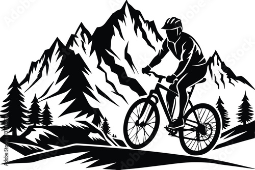 A man on a bike is riding down a hill with mountains in the background