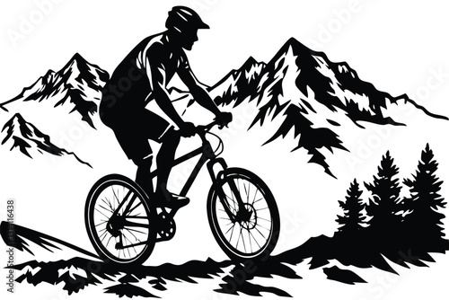 A man on a bike is riding down a hill with mountains in the background